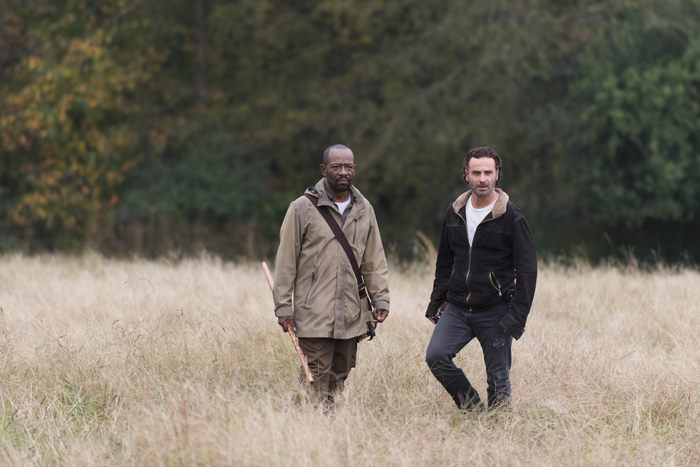 Lennie James and Rick Grimes walking in a field