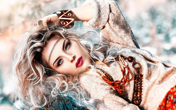 Woman with blonde hair and bohemian jewelry