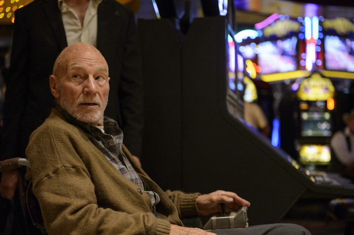 Patrick Stewart in a wheelchair at a casino