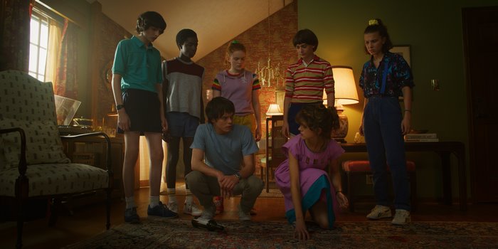 Stranger Things cast in a room