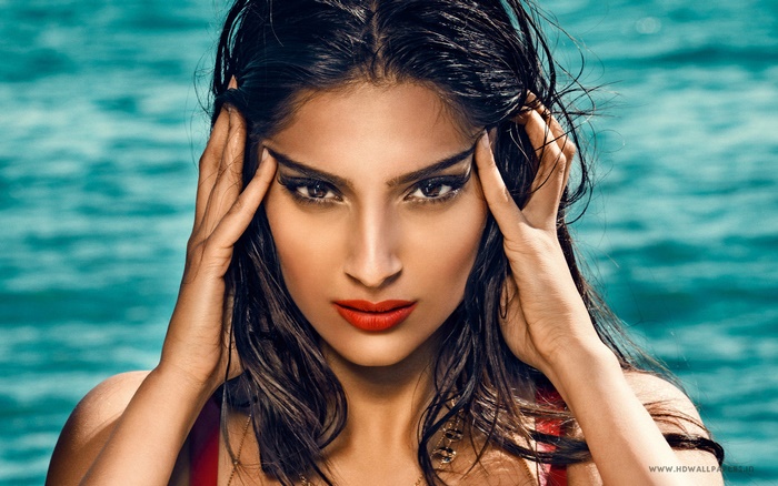 Sonam Kapoor in front of blue water