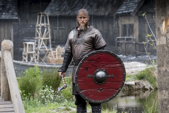 Travis Fimmel as Ragnar Lothbrok with shield and axe