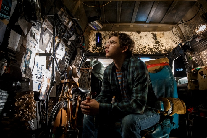Tye Sheridan in a cluttered room