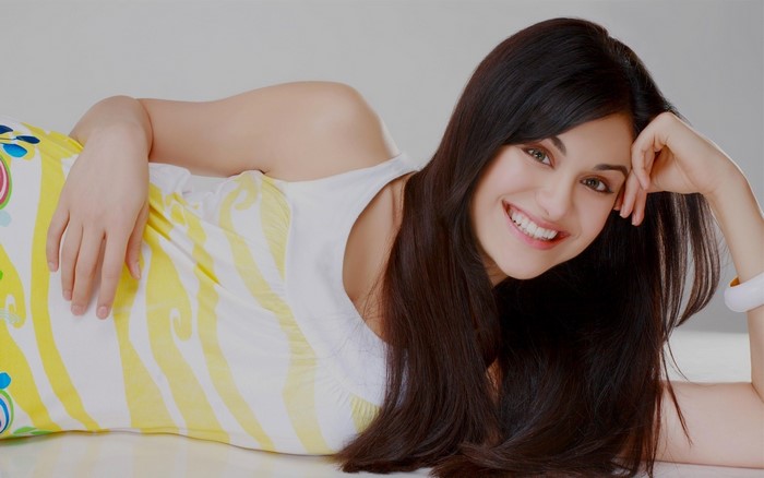 Adah Sharma lying down and smiling