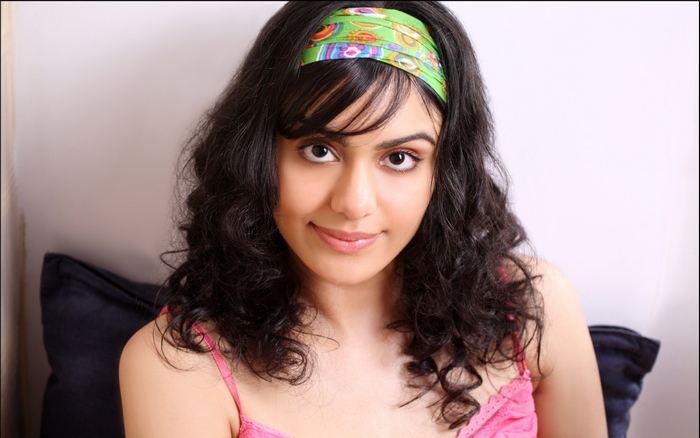 Adah Sharma wearing a pink top and green headband