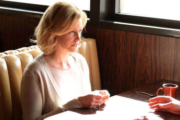 Anna Gunn in a booth
