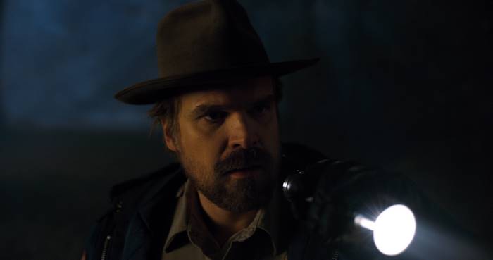 David Harbour with flashlight