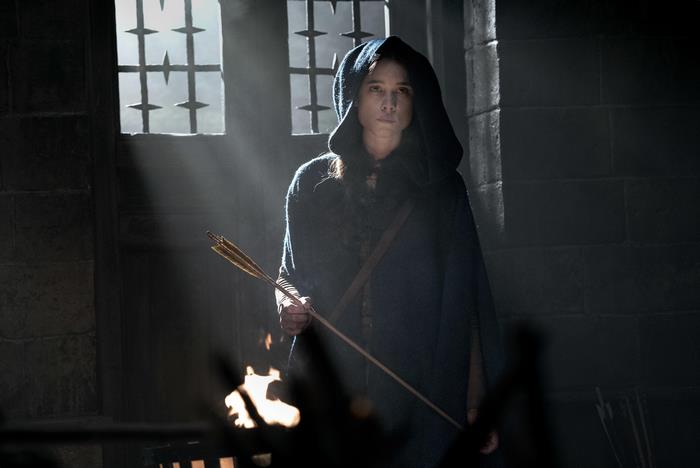 Astrid Bergès-Frisbey holding an arrow