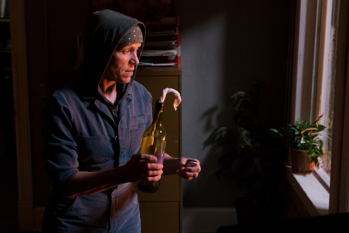 Frances McDormand holding a Molotov cocktail