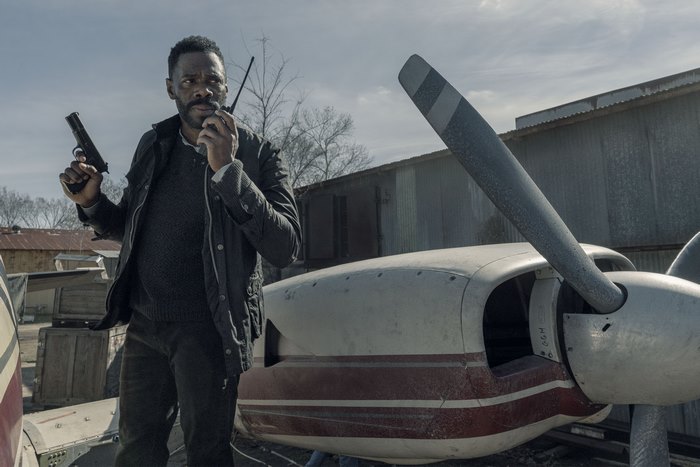 Colman Domingo with a gun and radio