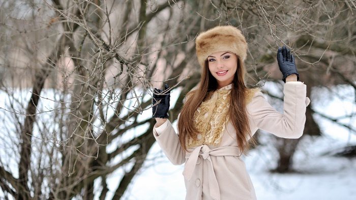 Woman in fur hat and coat in winter