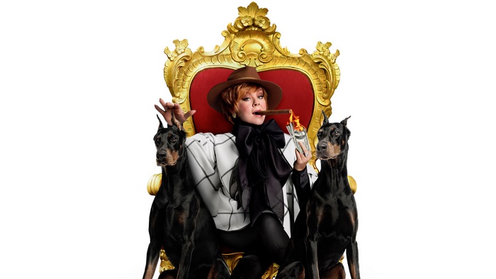 Melissa McCarthy on a throne with dogs