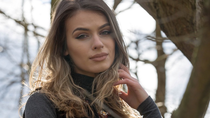 Woman with long wavy hair outdoors