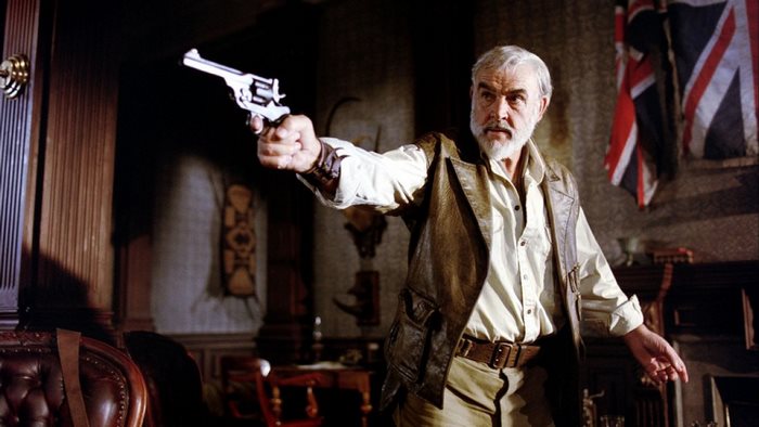 Sean Connery holding a revolver