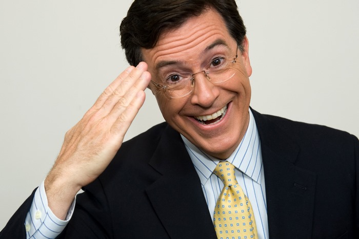 Stephen Colbert wearing a suit and tie