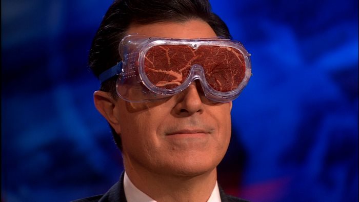 Stephen Colbert wearing goggles with meat