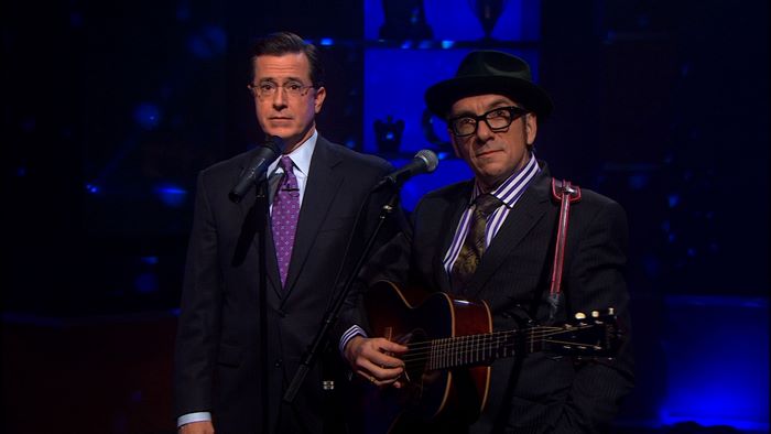 Stephen Colbert and Elvis Costello on stage