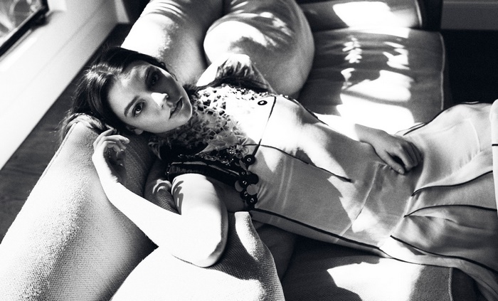 Anya Taylor-Joy lying on a couch