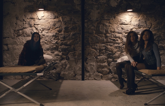 Anya Taylor-Joy in a stone room