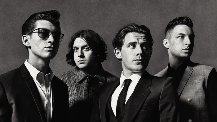 Arctic Monkeys band members in suits
