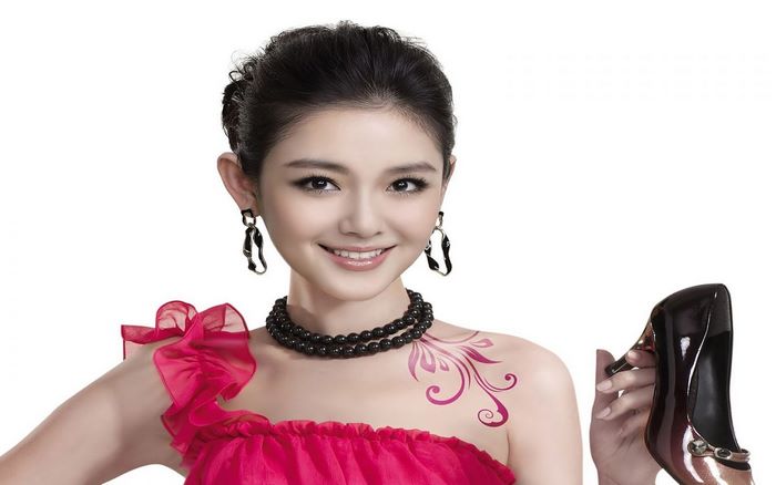 Barbie Hsu in a pink dress with a tattoo