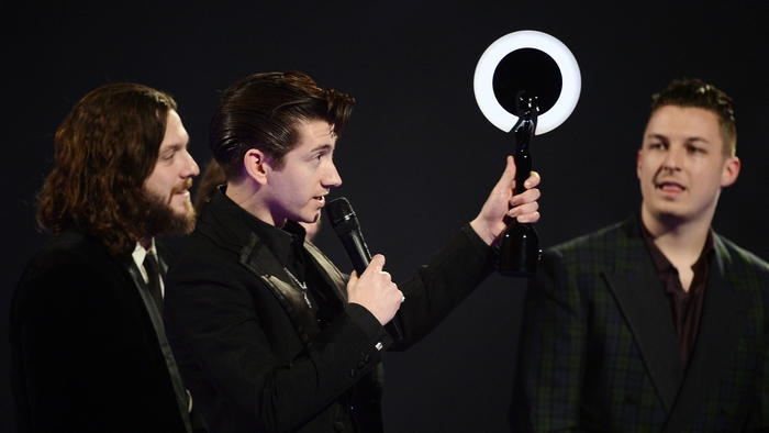 Arctic Monkeys accepting award