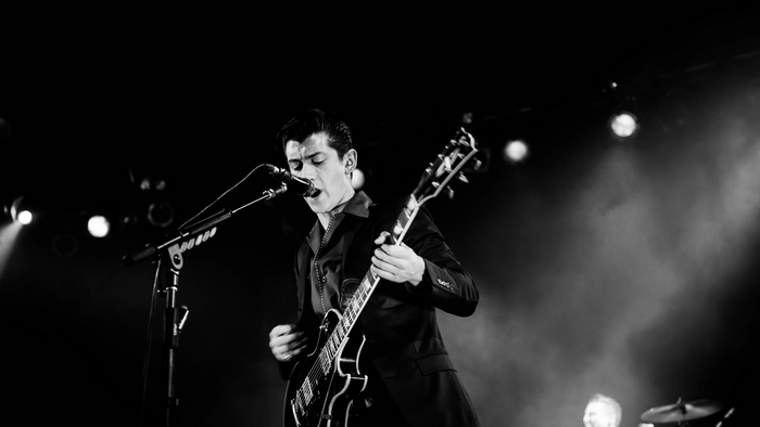 Alex Turner from Arctic Monkeys performing live