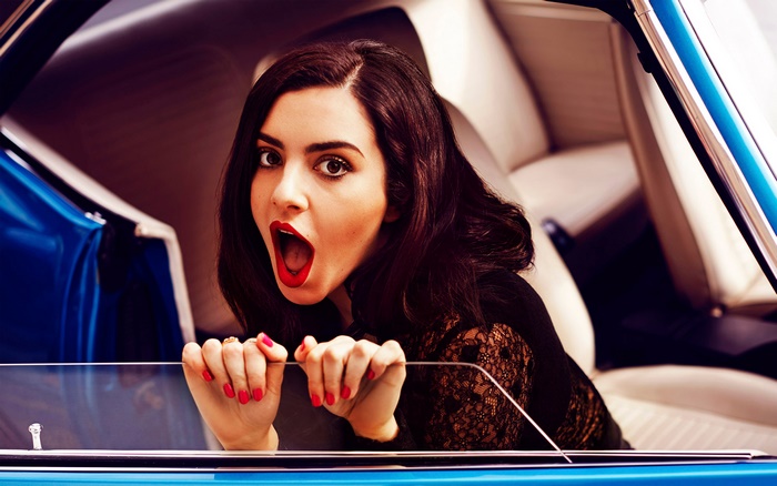 Charli XCX in a blue car