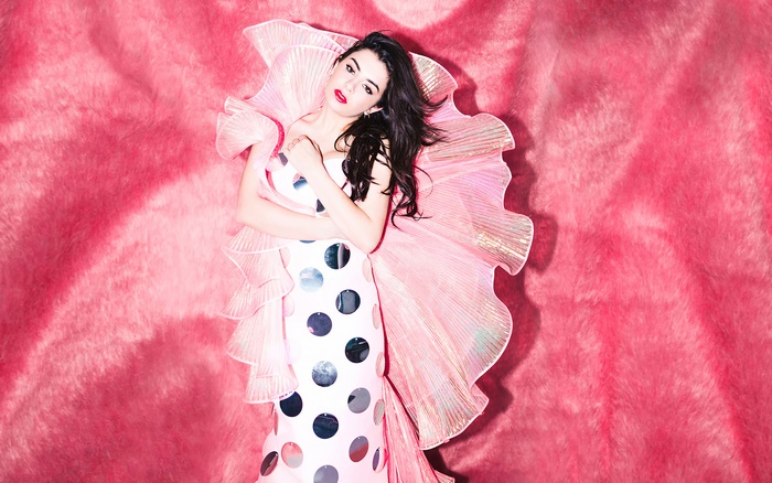 Charli XCX on pink fluffy background