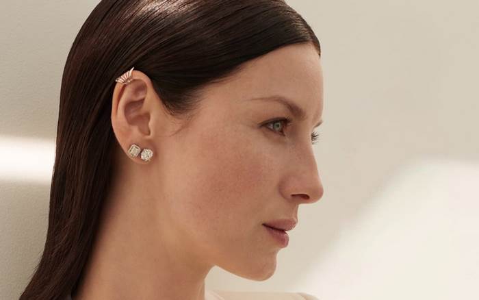 Caitriona Balfe wearing diamond earrings and ear cuff