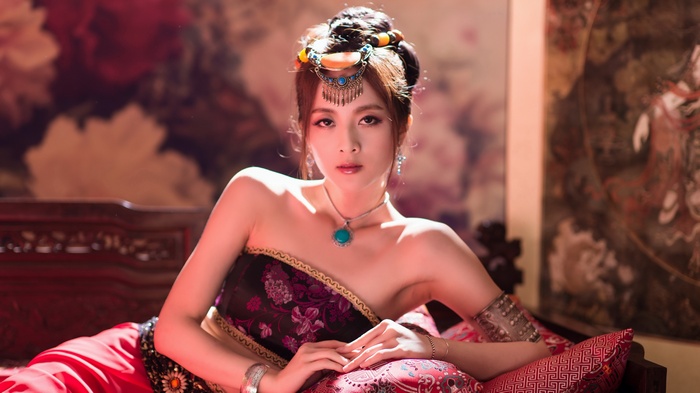 Woman in traditional costume with ornate jewelry