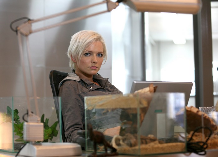 Hannah Spearritt sitting at a desk