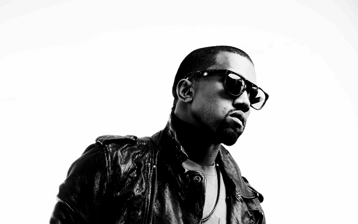 Kanye West wearing sunglasses and leather jacket