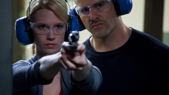 January Jones aiming a gun at a shooting range