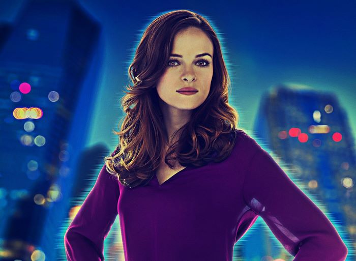 Danielle Panabaker in front of a city skyline
