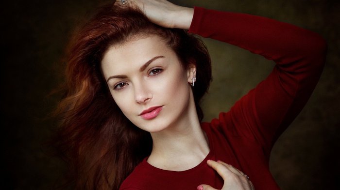 Woman with red hair and red shirt