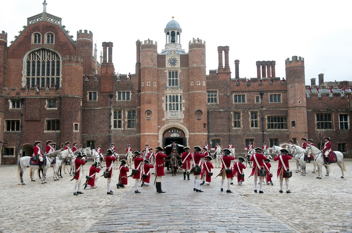 Kevin McNally in historical costumes outside a palace