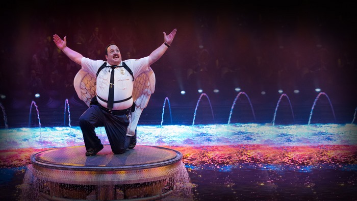 Kevin James with wings on stage