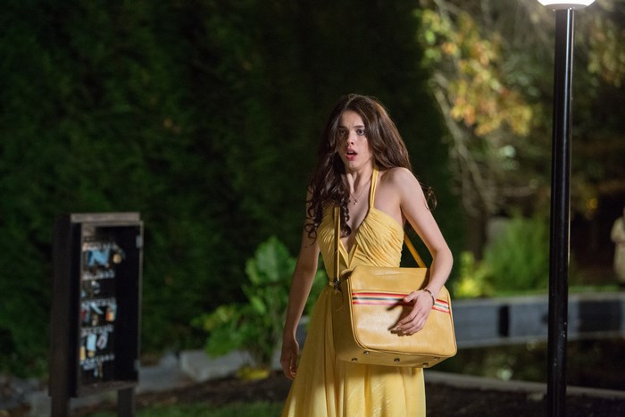 Margaret Qualley in yellow dress with purse