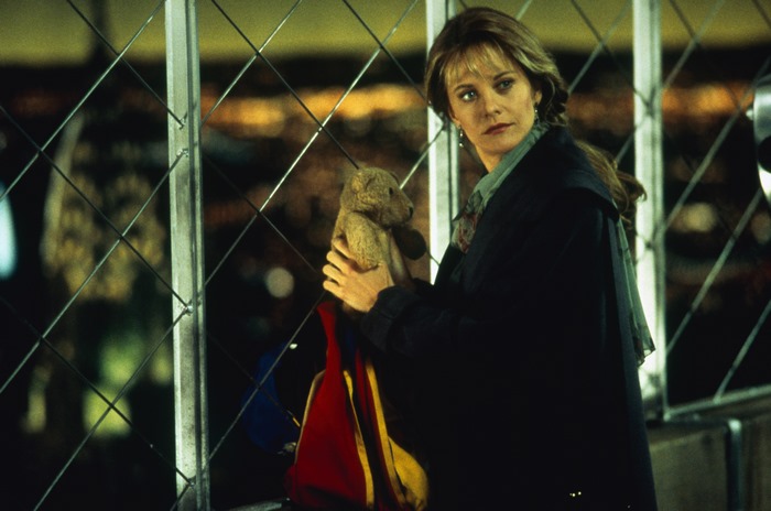 Meg Ryan holding a teddy bear