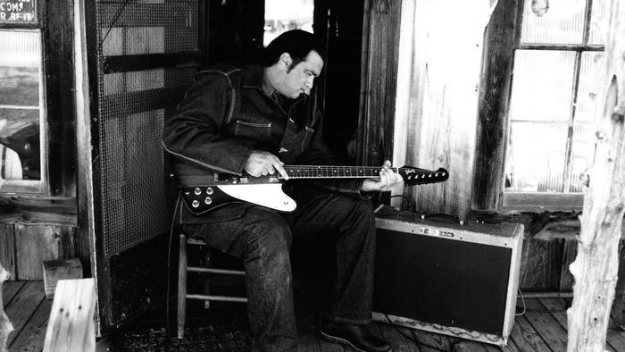 Steven Seagal playing guitar
