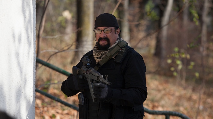 Steven Seagal with a rifle