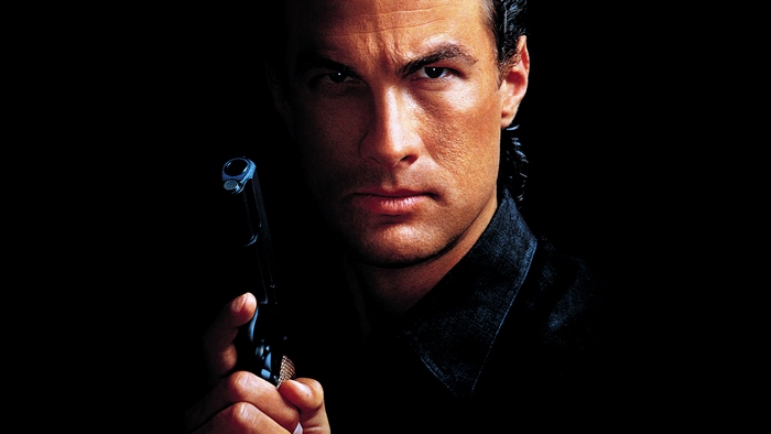 Steven Seagal holding a gun