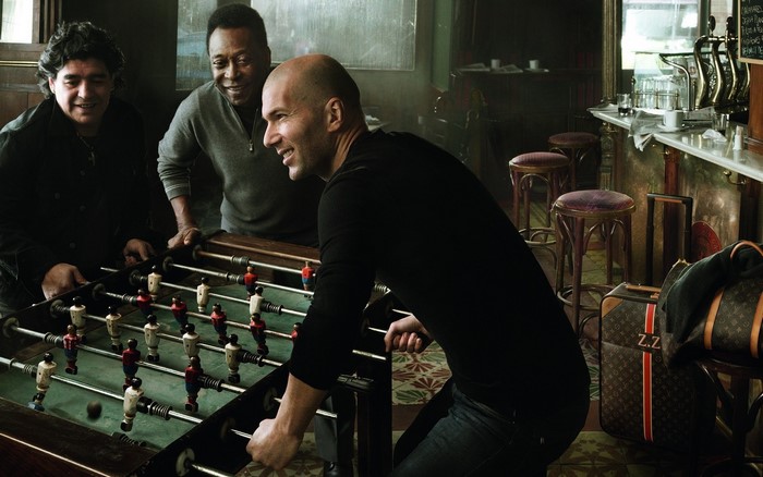 Diego Maradona, Pelé, and Zinedine Zidane playing foosball