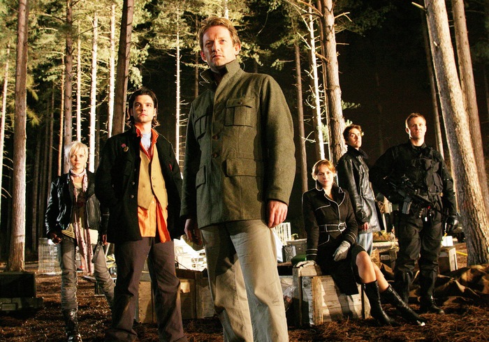 Group of people in a forest at night