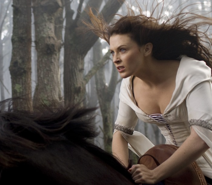 Bridget Regan on horseback in a forest