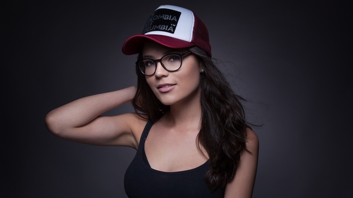 Woman wearing a hat and glasses