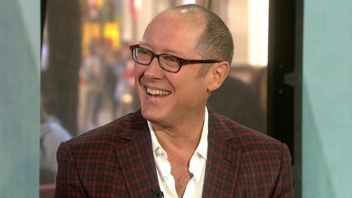 James Spader wearing glasses and a suit