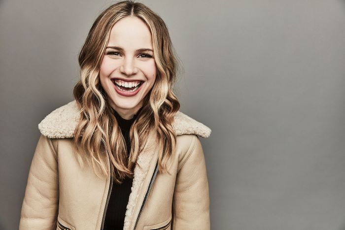 Halston Sage smiling