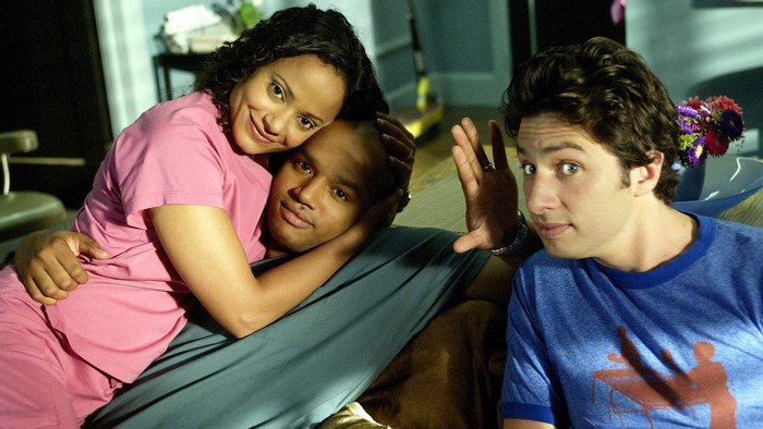 Judy Reyes and two men